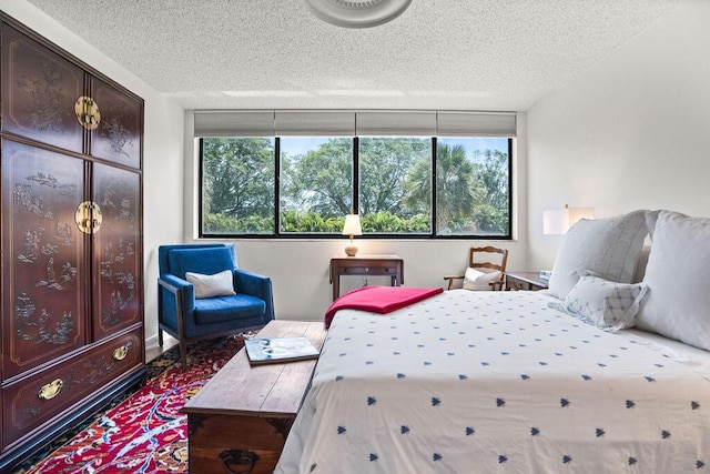 2520 Presidential Way Unit 203, West Palm Beach, FL 33401 - bedroom featuring a textured ceiling