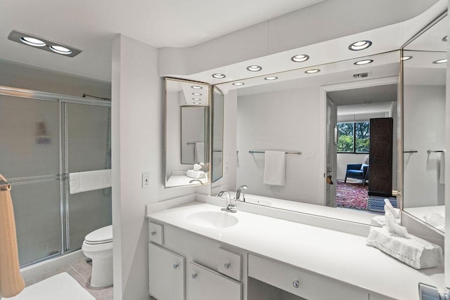 2520 Presidential Way Unit 203, West Palm Beach, FL 33401 - full bathroom featuring toilet, recessed lighting, a shower stall, vanity, and tile patterned floors