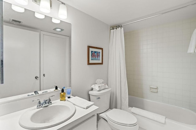 2520 Presidential Way Unit 203, West Palm Beach, FL 33401 - bathroom with vanity, shower / bathtub combination with curtain, and toilet