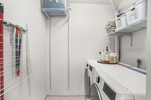 2520 Presidential Way Unit 203, West Palm Beach, FL 33401 - washroom featuring washer and dryer and light tile patterned floors