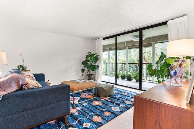 2520 Presidential Way Unit 203, West Palm Beach, FL 33401 - living room with tile patterned flooring, a textured ceiling, and floor to ceiling windows