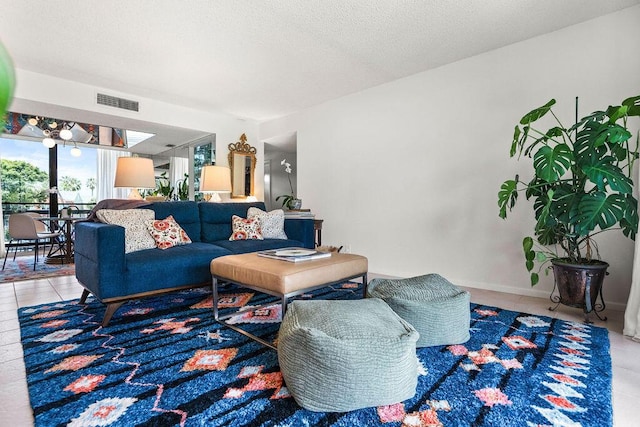 2520 Presidential Way Unit 203, West Palm Beach, FL 33401 - tiled living room featuring a textured ceiling