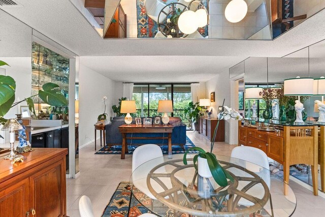 2520 Presidential Way Unit 203, West Palm Beach, FL 33401 - dining area with light tile patterned floors and baseboards