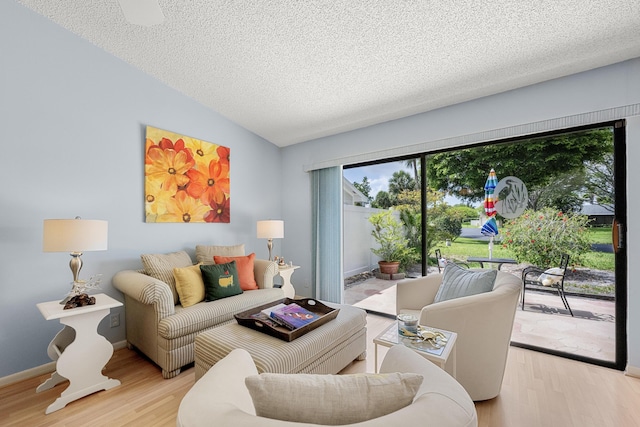 1 Danby Pl, Boynton Beach, FL 33426 - living room featuring wood finished floors, a textured ceiling, and baseboards