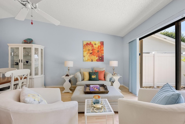 1 Danby Pl, Boynton Beach, FL 33426 - living area with lofted ceiling, a textured ceiling, ceiling fan, and light wood-style floors