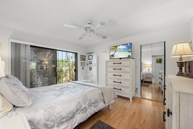 1 Danby Pl, Boynton Beach, FL 33426 - bedroom with access to outside, light wood-style flooring, a textured ceiling, and ceiling fan