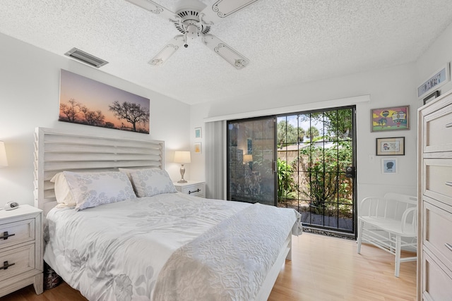 1 Danby Pl, Boynton Beach, FL 33426 - bedroom with light wood-style floors, a textured ceiling, ceiling fan, and access to exterior
