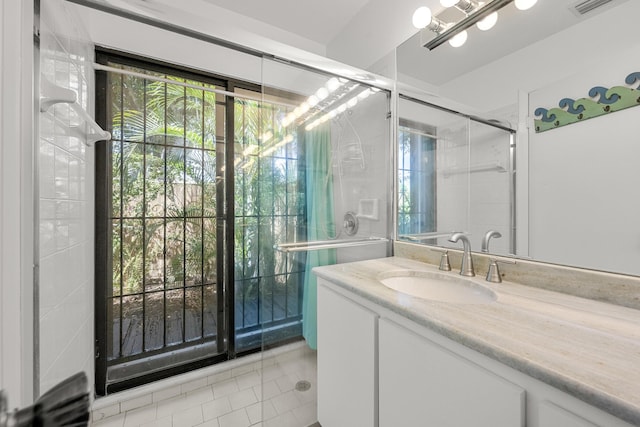 1 Danby Pl, Boynton Beach, FL 33426 - full bathroom featuring plenty of natural light, vanity, tile patterned floors, and a shower with door