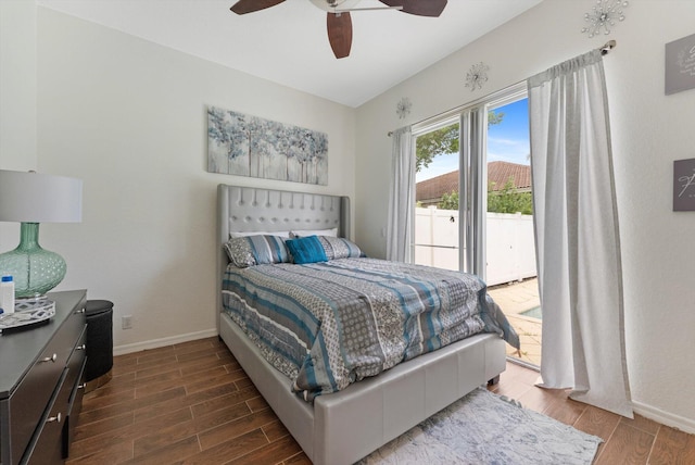 bedroom featuring baseboards, access to exterior, wood finished floors, and a ceiling fan