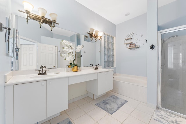 full bath featuring double vanity, a garden tub, a shower stall, and a chandelier