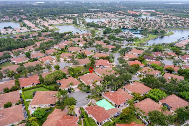 aerial overview of property's location with a large body of water and nearby suburban area