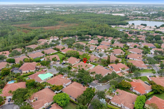 view of property location featuring a nearby body of water and nearby suburban area