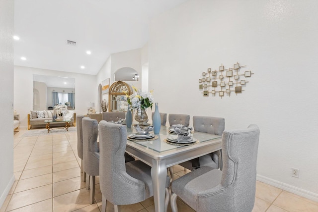 dining area with light tile patterned flooring, baseboards, and recessed lighting