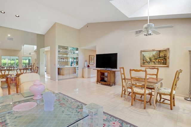 4721 Fountains Dr S, Lake Worth, FL 33467 - dining space with high vaulted ceiling, a ceiling fan, a skylight, tile patterned flooring, and baseboards