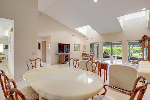 4721 Fountains Dr S, Lake Worth, FL 33467 - dining space featuring high vaulted ceiling, a skylight, a ceiling fan, baseboards, and light tile patterned floors