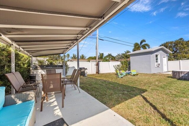 921 SE 13th Ct, Deerfield Beach, FL 33441 - view of patio / terrace featuring outdoor dining space and an outbuilding