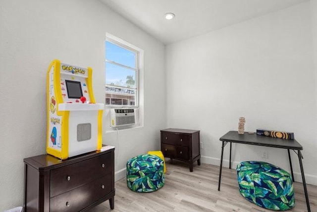921 SE 13th Ct, Deerfield Beach, FL 33441 - recreation room with wood finished floors, cooling unit, and baseboards