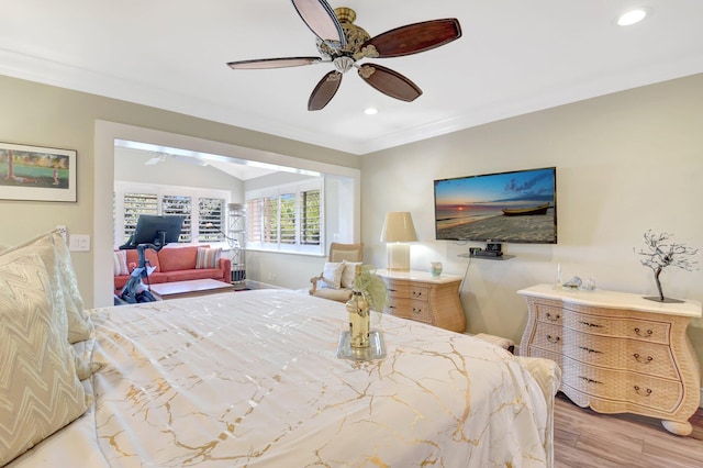 bedroom featuring light wood finished floors, ornamental molding, recessed lighting, ceiling fan, and vaulted ceiling