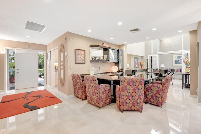 dining room with baseboards and recessed lighting