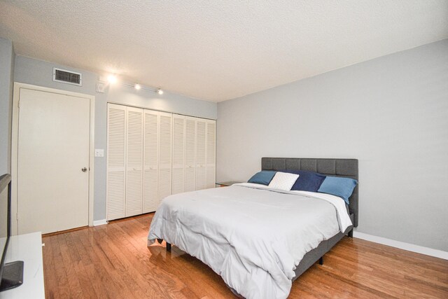 799 Jeffery St Unit 101, Boca Raton, FL 33487 - bedroom with wood finished floors, a closet, and baseboards