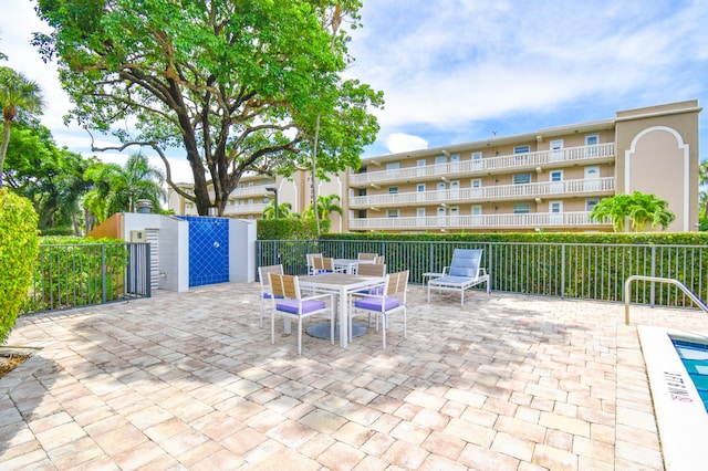 799 Jeffery St Unit 101, Boca Raton, FL 33487 - view of patio / terrace featuring fence and outdoor dining space