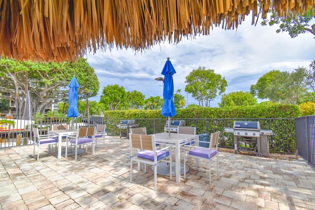 799 Jeffery St Unit 101, Boca Raton, FL 33487 - view of patio / terrace with outdoor dining area, grilling area, and fence