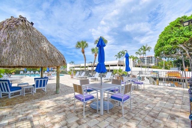 799 Jeffery St Unit 101, Boca Raton, FL 33487 - view of patio / terrace with a community pool and outdoor dining area