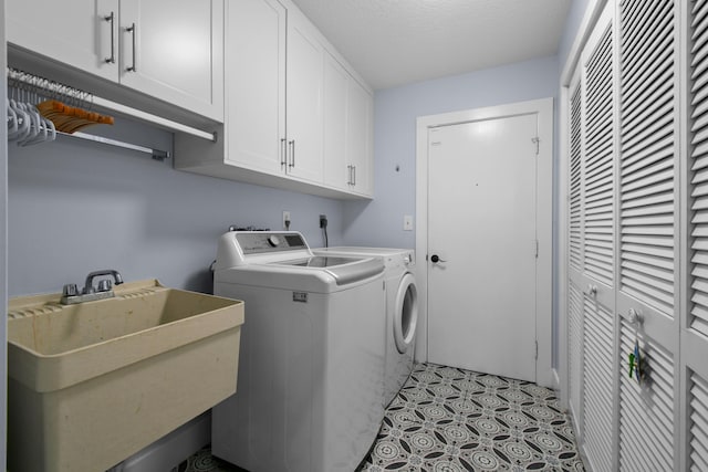 laundry area featuring washer and dryer and cabinet space