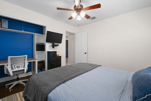 bedroom with wood finished floors and a ceiling fan