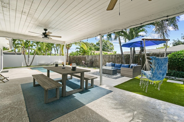 view of patio / terrace featuring a ceiling fan, a fenced backyard, and an outdoor hangout area