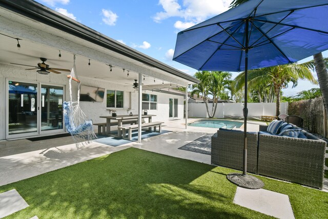 exterior space featuring ceiling fan, a patio, and stucco siding