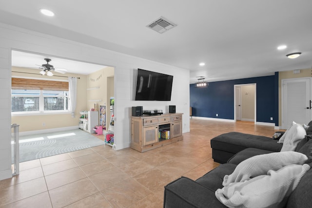 living area with recessed lighting, light tile patterned floors, baseboards, and ceiling fan