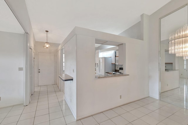 6078 Sunny Pointe Cir, Delray Beach, FL 33484 - hall featuring light tile patterned floors, a chandelier, and healthy amount of natural light