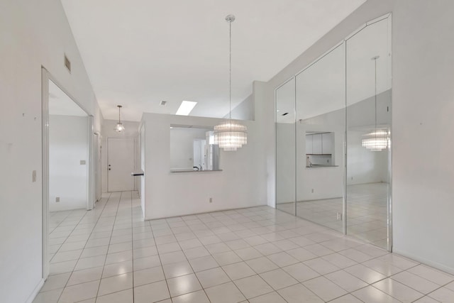 6078 Sunny Pointe Cir, Delray Beach, FL 33484 - spare room with a chandelier, light tile patterned floors, and high vaulted ceiling