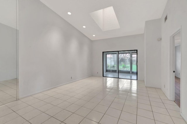 6078 Sunny Pointe Cir, Delray Beach, FL 33484 - spare room with a towering ceiling, a skylight, light tile patterned floors, and recessed lighting