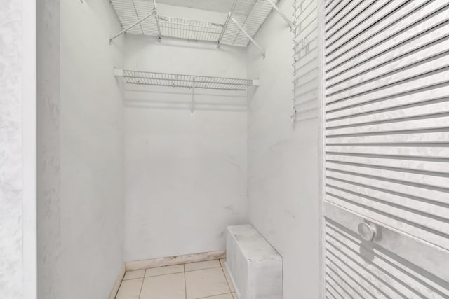 6078 Sunny Pointe Cir, Delray Beach, FL 33484 - spacious closet featuring light tile patterned flooring