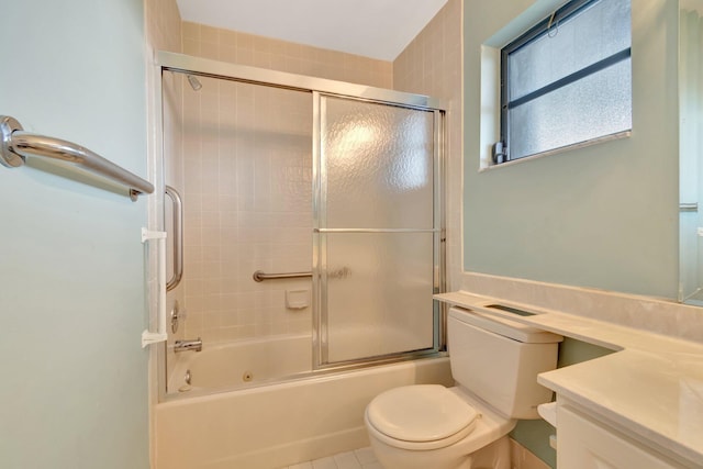 6078 Sunny Pointe Cir, Delray Beach, FL 33484 - bathroom with bath / shower combo with glass door, toilet, tile patterned flooring, and vanity
