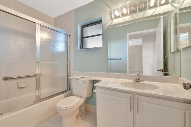 6078 Sunny Pointe Cir, Delray Beach, FL 33484 - full bathroom featuring tile patterned floors, toilet, enclosed tub / shower combo, and vanity