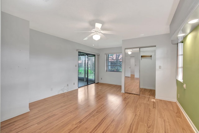 6078 Sunny Pointe Cir, Delray Beach, FL 33484 - unfurnished bedroom featuring access to outside, light wood-style floors, baseboards, and a ceiling fan