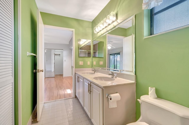 6078 Sunny Pointe Cir, Delray Beach, FL 33484 - bathroom with tile patterned floors, a ceiling fan, toilet, and double vanity