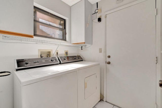 6078 Sunny Pointe Cir, Delray Beach, FL 33484 - laundry area with washing machine and clothes dryer, cabinet space, and light tile patterned floors