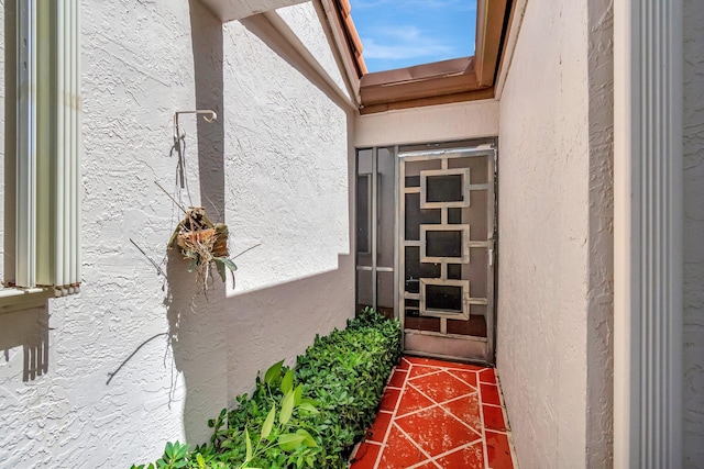 6078 Sunny Pointe Cir, Delray Beach, FL 33484 - doorway to property with stucco siding