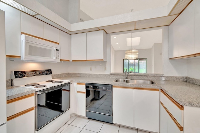6078 Sunny Pointe Cir, Delray Beach, FL 33484 - kitchen featuring white appliances, a sink, light countertops, light tile patterned floors, and white cabinets