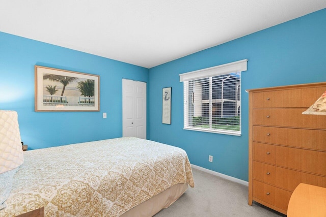 234 Pine Hov Cir Unit B-1, Greenacres, FL 33463 - bedroom featuring carpet floors, baseboards, and a closet