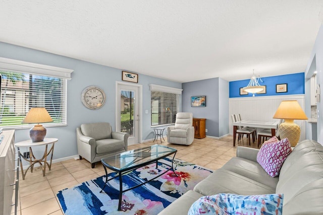234 Pine Hov Cir Unit B-1, Greenacres, FL 33463 - living area featuring light tile patterned floors, a textured ceiling, and baseboards