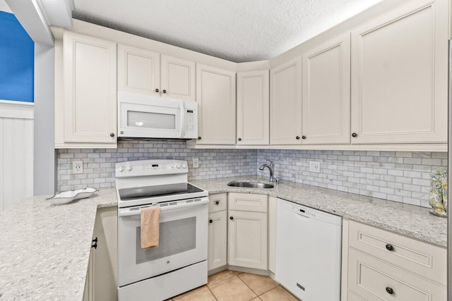 234 Pine Hov Cir Unit B-1, Greenacres, FL 33463 - kitchen featuring white appliances, a sink, tasteful backsplash, light stone countertops, and a textured ceiling