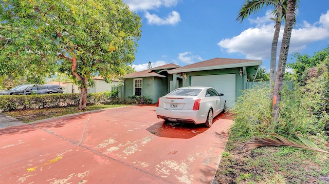 339 NW 5th Ave, Delray Beach, FL 33444 - single story home featuring a garage, concrete driveway, and stucco siding