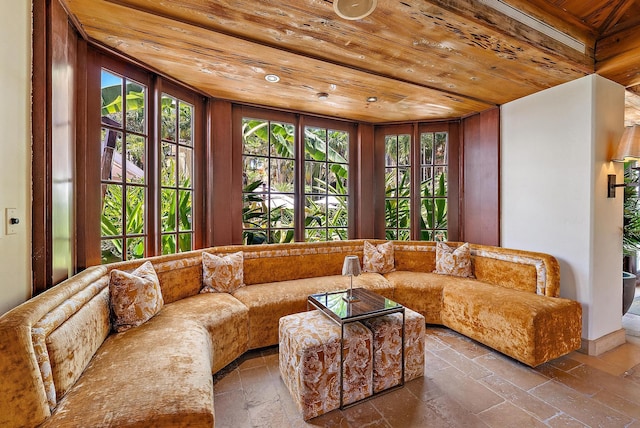 301 Australian Ave Unit 305, Palm Beach, FL 33480 - living room with wood ceiling, stone tile floors, and healthy amount of natural light