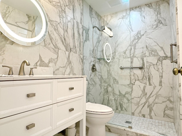 11666 Briarwood Cir Unit 1, Boynton Beach, FL 33437 - bathroom with toilet, a marble finish shower, vanity, and tile walls