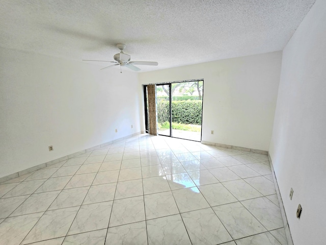 20975 Del Casa Dr, Boca Raton, FL 33433 - empty room with a ceiling fan, a textured ceiling, baseboards, and light tile patterned floors